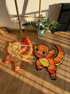 an image of two cartoon animals on the floor