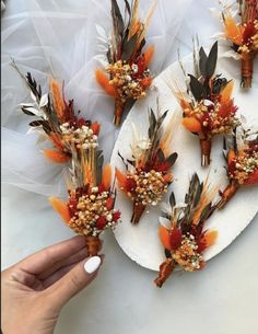 a plate with flowers and feathers on it