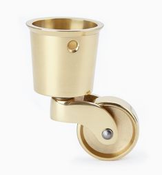 an image of a brass cup holder with wheels on white backgroung background