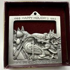 a metal plaque with an image of harley davidson on it