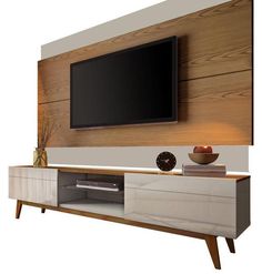 an entertainment center with a flat screen tv mounted on it's sideboard and two vases in front of it