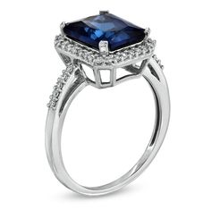 Regal and radiant, this exquisite fashion ring was designed to captivate the September-born birthday girl. Crafted in fine sterling silver, the eye is drawn to the mesmerizing 10.0 x 8.0mm emerald-cut, lab-created blue sapphire center stone. A frame of shimmering lab-created white sapphires surrounds the gemstone and lines the polished shank. Buffed to a brilliant shine, this ring is destined to become a treasured favorite. Custom made to fit her ring size. Sterling silver rings cannot be resized after purchase. Pink Sapphire Fine Jewelry Ring, Emerald Cut Sapphire Ring For Anniversary, Fine Jewelry Halo Ring Gift, Halo Ring As Gift, Sapphire Ring With Halo Design, Formal Birthstone Ring With Halo, Formal Halo Birthstone Ring, Modern Sapphire Ring With Diamond Accents As A Gift, Radiant Cut Halo Ring Fine Jewelry