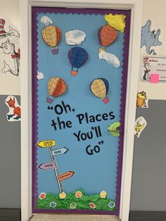 a door decorated with paper cutouts that says oh, the places you'll go