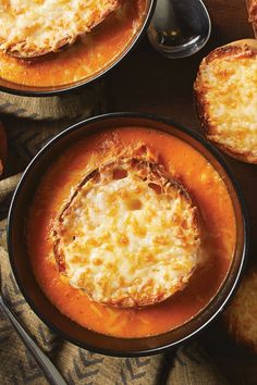 two pans filled with food sitting on top of a table