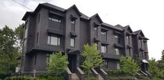 an apartment building with stairs leading up to it