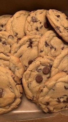 a box full of chocolate chip cookies sitting on top of a table