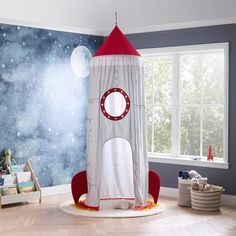 a child's bedroom with a rocket ship bed