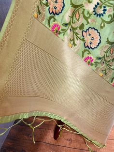 Paithani Style Floral Semi Banarasi Silk Dupatta. Meenakari Work with muted gold Zari Work. Handloom Dupatta, very light weight and soft. Item: DupattaBase color : Light Pista GreenFabric : Banarasi Semi Soft Silk (Not Pure Silk)Work : Weaved with tasselsLength of the Dupatta : 88 inches approx.Width of the dupatta : 34 1/2 inches (Approx.)Please note there are threads on the back side of the dupatta. Store Policies- No return or exchange will be accepted for color variations.- No return or exch Benarasi Dupatta, Handloom Dupatta, Floral Dupatta, Pista Green Colour, Pista Green, Nehru Jackets, Readymade Blouse, Zari Work, Buy Lights