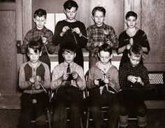 a group of young boys sitting next to each other