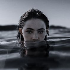 a woman is submerged in the water