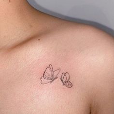 a small butterfly tattoo on the chest