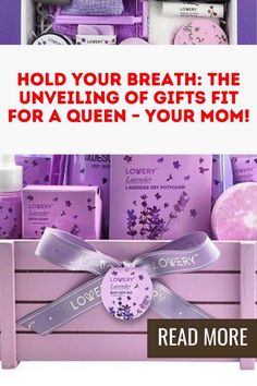 a pink box filled with lots of different items next to a sign that says, hold your breath the unveiling of gifts fit for a queen - your mom