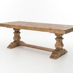 an old wooden table with two legs and a long slab on the top, against a white background