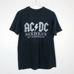 Ac/Dc Official Back In Black T-Shirt - Medium - Ultra Soft, High End Jersey - Official Ac/Dc Merchandise - Back In Black' 40th Anniversary Collection Please Contact Me With Any Questions! Black Band Logo T-shirt For Concert, Rock Style Band Logo T-shirt With Crew Neck, Black Band Merch T-shirt With Logo, Black Band Logo Top For Music Festivals, Black Band Logo Crew Neck Top, Rock Style T-shirt With Logo For Concerts, Rock Style Cotton T-shirt With Logo Print, Black Crew Neck Tops With Band Logo, Black Crew Neck Top With Band Logo