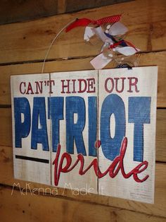 a wooden sign that says can't hide our patriotic pride