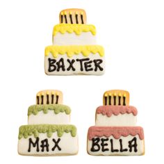 three decorated cookies with the words baxter and max on them