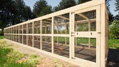 a chicken coop with several chickens in it