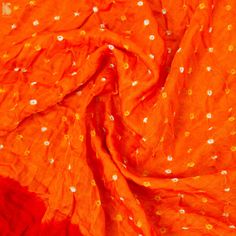 Category: Bandhani Fabric Fabric - Pure Gajji Silk Color - Red & Orange Weave: Bandhani derived from a Sanskrit word Banda which meaning “to tie” is truly an art that involves dyeing a fabric tied tightly with a thread at several points, producing a variety of patterns and then dyed with extraordinary colors. Kurta and dupatta set Note- There may be slight color variations due to photographic reasons. This is a hand-woven product and any irregularities in the weaving or pattern should not be tak Luxury Cotton Silk Dupatta With Bandhani Print, Cheap Traditional Bandhani Print Dupatta, Bandhani Fabric, Bandhani Suit, Kurta And Dupatta, Sanskrit Words, Suit Design, Dupatta Set, Suit Fabric