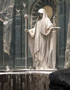 a statue of the virgin mary holding a cross in front of a church entrance with stained glass windows