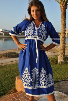 This beautiful bohemian embroidered tunic dress is surely going to add life and oriental charm to your closet. The dress is made of Egyptian cotton which is widely renowned for its quality and texture. The dress is light and extremely soft and can be used on many occasions - beach, lounge, or even in your home to feel comfortable. Fabric : 70% Egyptian Cotton; 30% Polyester. Tunic measurements in inches : Small (Size 4/6 USA) Bust : 36-37 Hip : 40-41 Medium (Size 8/10 USA) Bust : 39-40 Hip : 45- Traditional V-neck Dress With Embroidered Neckline, Intricate Embroidered Tunic Dress For Festivals, Traditional V-neck Dress With Embroidered Border, Folk Style Tunic Dress With Intricate Embroidery, Traditional Tunic Embroidered Dress, Cotton V-neck Dress With Resham Embroidery, V-neck Dresses For Vacation Festivals, Traditional Embroidered Dress With Embroidered Hem, Intricately Embroidered Beach Kaftan For Spring