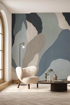 a modern living room with an abstract wallpaper