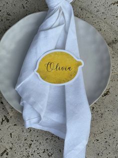 a white plate topped with a yellow napkin