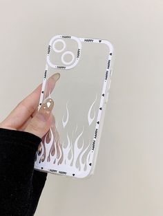 a person holding up a phone case with flames on it's back and sides