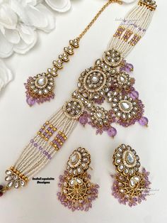 Premium quality Kundan pearls Choker comes with gorgeous Jhumki Earrings and Tikka/ Indian Jewelry/Unique Polki and Kundan Jewelry/lavender/lilac/light purple       All items are shipped from Brampton, Ontario, Canada. If you need your item by a certain day, please reach out to us for express delivery option before placing the order so that we can update the shipping for you. Standard shipping/delivery timeline Below are the delivery timeline estimates. We dispatch all orders by the next busines Purple Stone Work Jewelry For Wedding, Elegant Purple Jewelry For Diwali, Purple Kundan Necklace For Gifting, Purple Kundan Necklace Gift, Purple Kundan Bollywood Jewelry, Purple Kundan Jewelry For Diwali, Festive Purple Kundan Jewelry, Purple Meenakari Jewelry For Wedding, Purple Jewelry For Wedding On Diwali