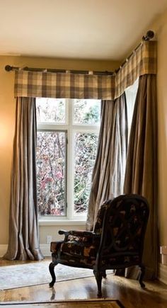 a chair sitting in front of a large window