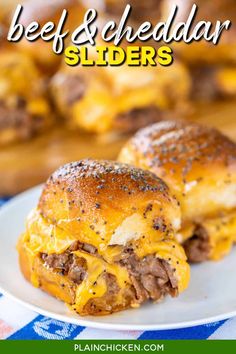 two cheeseburger sliders on a plate with blue and white checkered table cloth