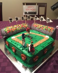 a baseball themed birthday cake on a table