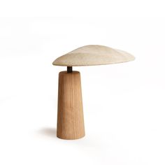 a wooden table lamp with a white background