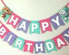 a birthday banner with the words happy birthday and paw patrol on it, hanging from a wall