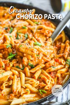 a skillet filled with pasta and sauce