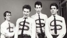 four men wearing ties with the letters $ on them