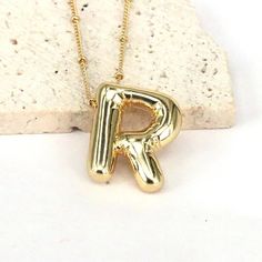 Bubble/Balloon Letter R Initial Necklace Elevate Your Style With Our Very Popular Gold Bubble Initial Necklace. Balloon Letter Pendant On A Delicate Beaded Satellite Chain. Chain Length - 17 1/2- 19 1/2 Inches All Jewelry Comes Beautifully Packaged And Ready For Gift Giving. #Balloon #Bubble #Necklace #Initial #Gold R Initial Necklace, R Initial, Bubble Necklace, Gold Bubbles, Bubble Balloons, Necklace Initial, Letter Balloons, Letter R, Gold Initial