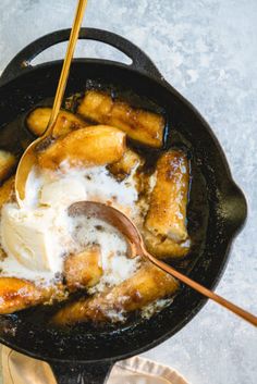 a skillet filled with bananas and ice cream