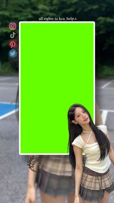 a girl holding a green screen in front of her face