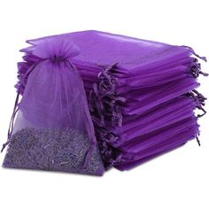 a stack of purple bags filled with lots of lavenders on top of each other