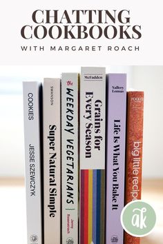 a stack of books sitting on top of a wooden table