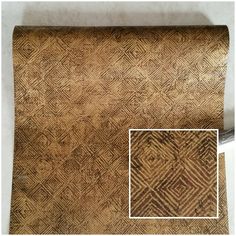 the fabric is brown and has an intricate pattern on it