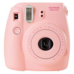 a pink polaroid camera sitting on top of a white surface