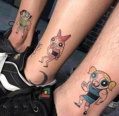 two people with matching tattoos on their legs