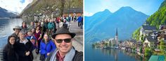 a group of people standing on the side of a lake next to mountains and buildings