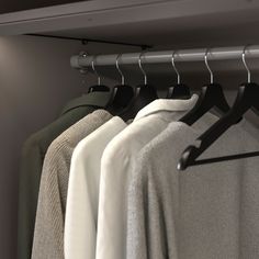 a row of clothes hanging on a rail