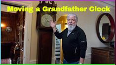 a man standing in front of a grandfather clock with the caption moving a grandfather clock