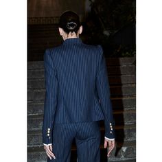 The Navy Pinstripe Premium Crepe Single Breasted Blazer Rue Cambon is a refined piece that blends classic tailoring with unique details. Crafted from premium navy blue super crepe fabric with a sleek pinstripe pattern, this navy pinstripe blazer features gathered shoulder pads for a structured look. A mandarin collar combined with lapels adds a modern twist, accentuated by a jewel brooch. The blazer includes slanted flap pockets and a welt pocket at the top for added sophistication. It fastens w Luxury Striped Suits With Double Button Closure, Luxury Formal Shirt With Spread Collar, Jewel Brooch, Classic Tailoring, Pinstripe Blazer, Pinstripe Pattern, Single Breasted Blazer, Spanish Fashion, Blazer Jackets For Women