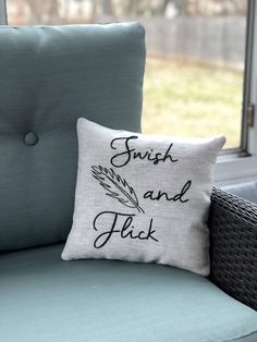 a pillow that says, brush and flak on it sitting next to a chair