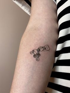 a person with a small tattoo on their arm