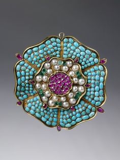 Brooch | V&A Search the Collections English Brooch with turquoise, rubies, emeralds and pearls c. 1835 Victorian Brooch, Tudor Rose, Antique Pendant, Ruby Pendant, Ruby Emerald, Victorian Gold, Colored Stones, Emerald Pendant, Work Jewelry